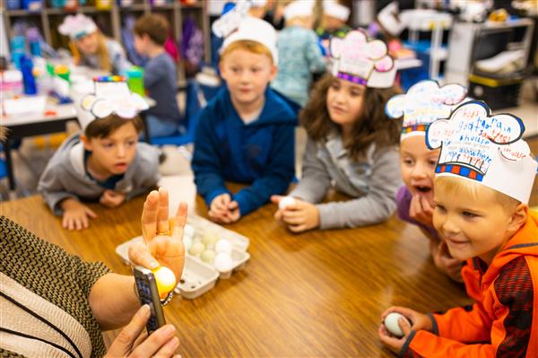 Students learning about Green Eggs and Ham and how to make them. 